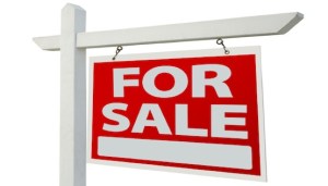 Home For Sale Real Estate Sign Isolated on a White Background.
